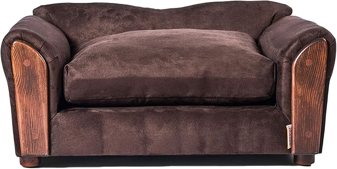 Golden retriever happily lounging on a brown dog sofa.